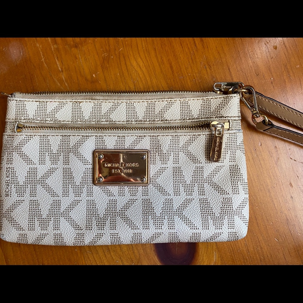 Medium sized White Michael Kors wristlet.